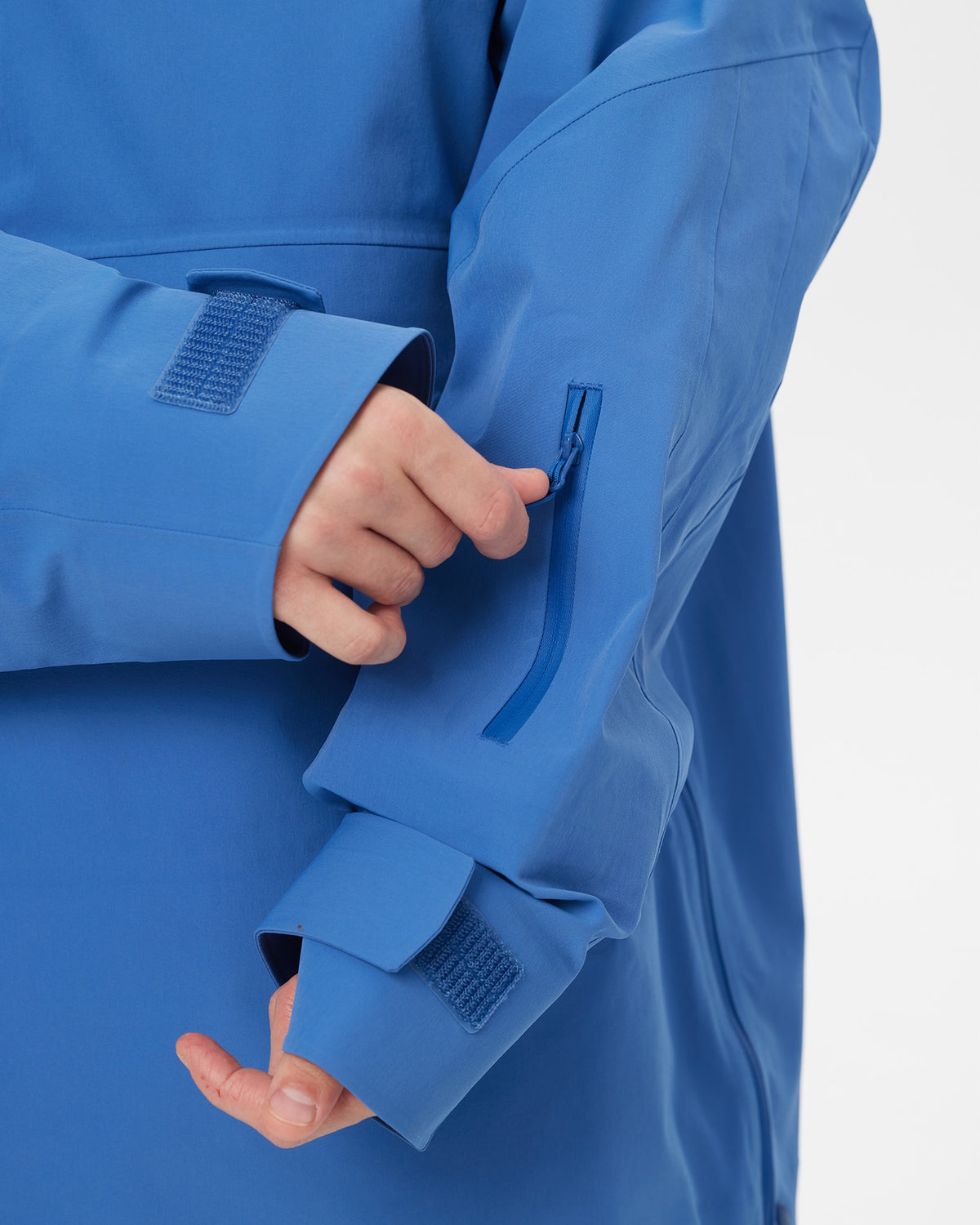 Close-up of the sleeve ski pass pocket and adjustable cuff on the Nobaday Men’s ArcticStorm 3L Anorak Snow Jacket in blue