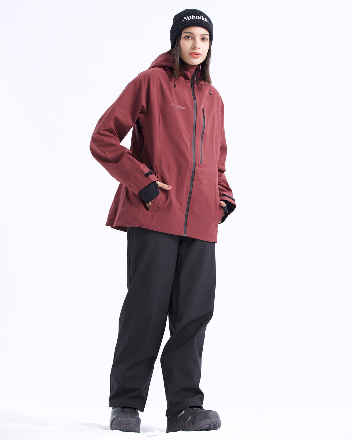 Full-body view of the NOBADAY Women's Juicy 3L dark red waterproof snow jacket with a slim fit and black snow pants