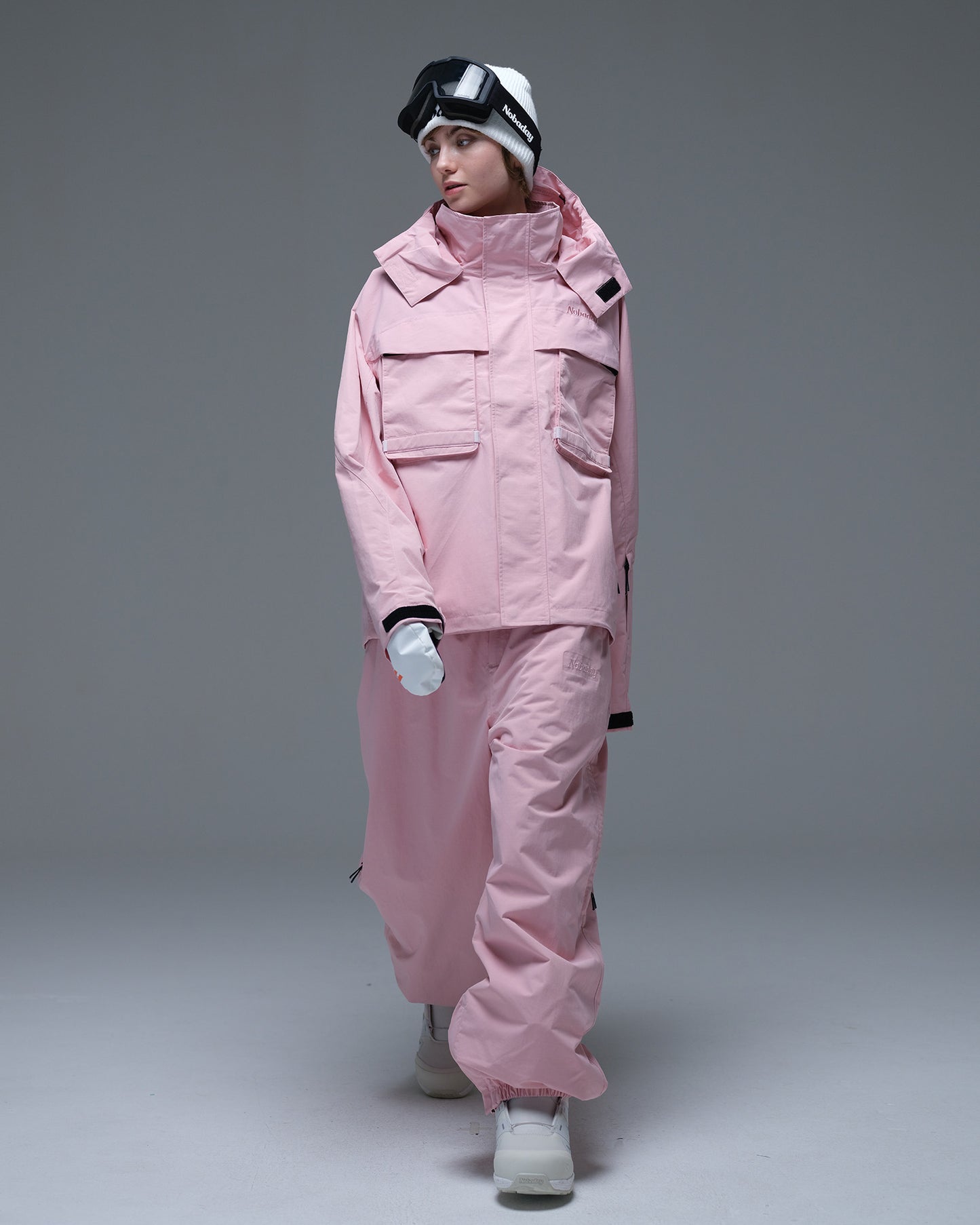 Full-body view of the pink Nobaday Women’s Pure Free Drift Snow Jacket styled with matching pink snow pants