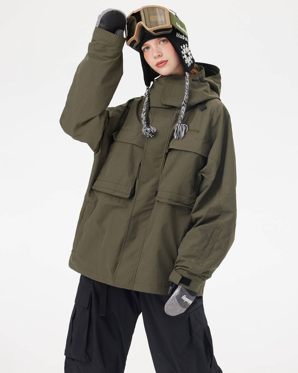 Half-body pose of a woman wearing the NOBADAY Women's Pure Free Freestyle dark green waterproof snow jacket