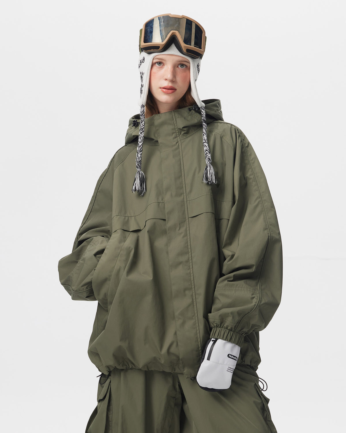 Front view of Nobaday Women's Pure Free green waterproof snow jacket with storm flap, hood, elastic cuffs, and oversized silhouette