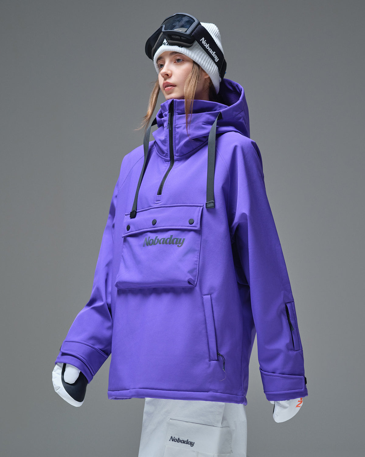 Side front detail of Nobaday women's purple waterproof fleece hoodie with half zip, chest pocket, and sleeve pass pocket