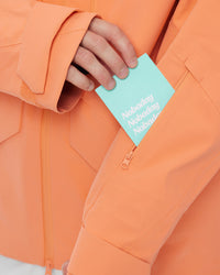 Close-up of the zippered sleeve pass pocket on the Nobaday ArcticStorm Freeride Orange 3L Snow Jacket