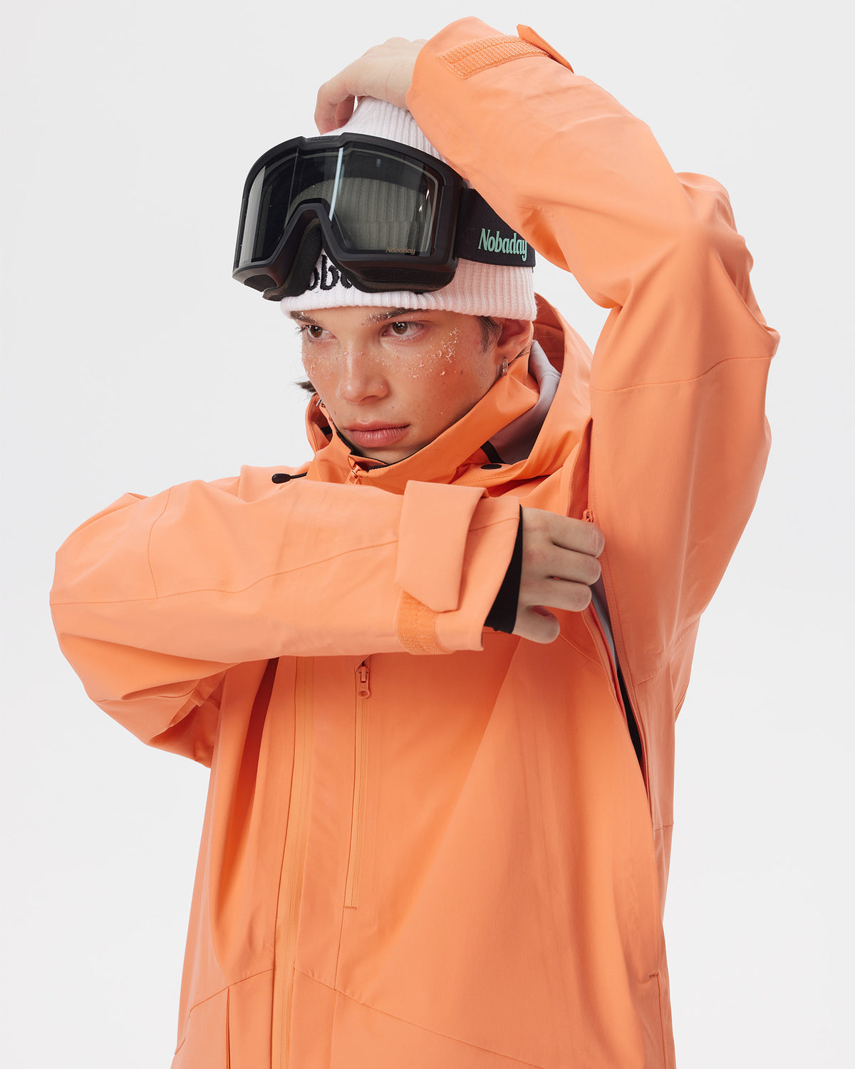 Close-up of the underarm ventilation zipper on the Nobaday ArcticStorm Freeride Orange 3L Snow Jacket