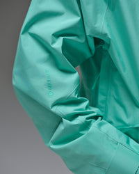 Close-up of the GORE-TEX sleeve logo and waterproof fabric on a Nobaday Blue snow jacket