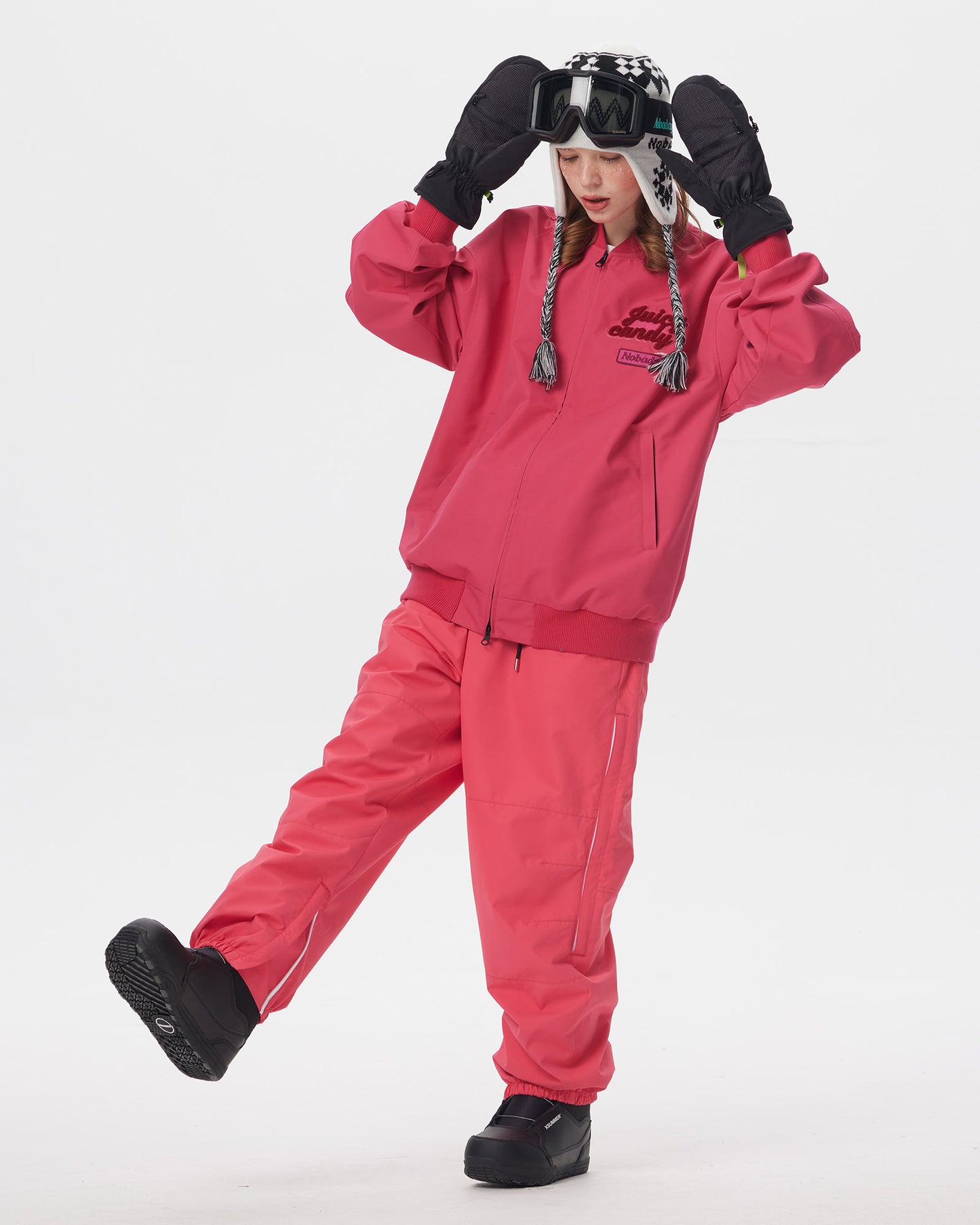 Full-body action view of a model wearing the Nobaday Juicy Dark Red Jacket with matching snow pants
