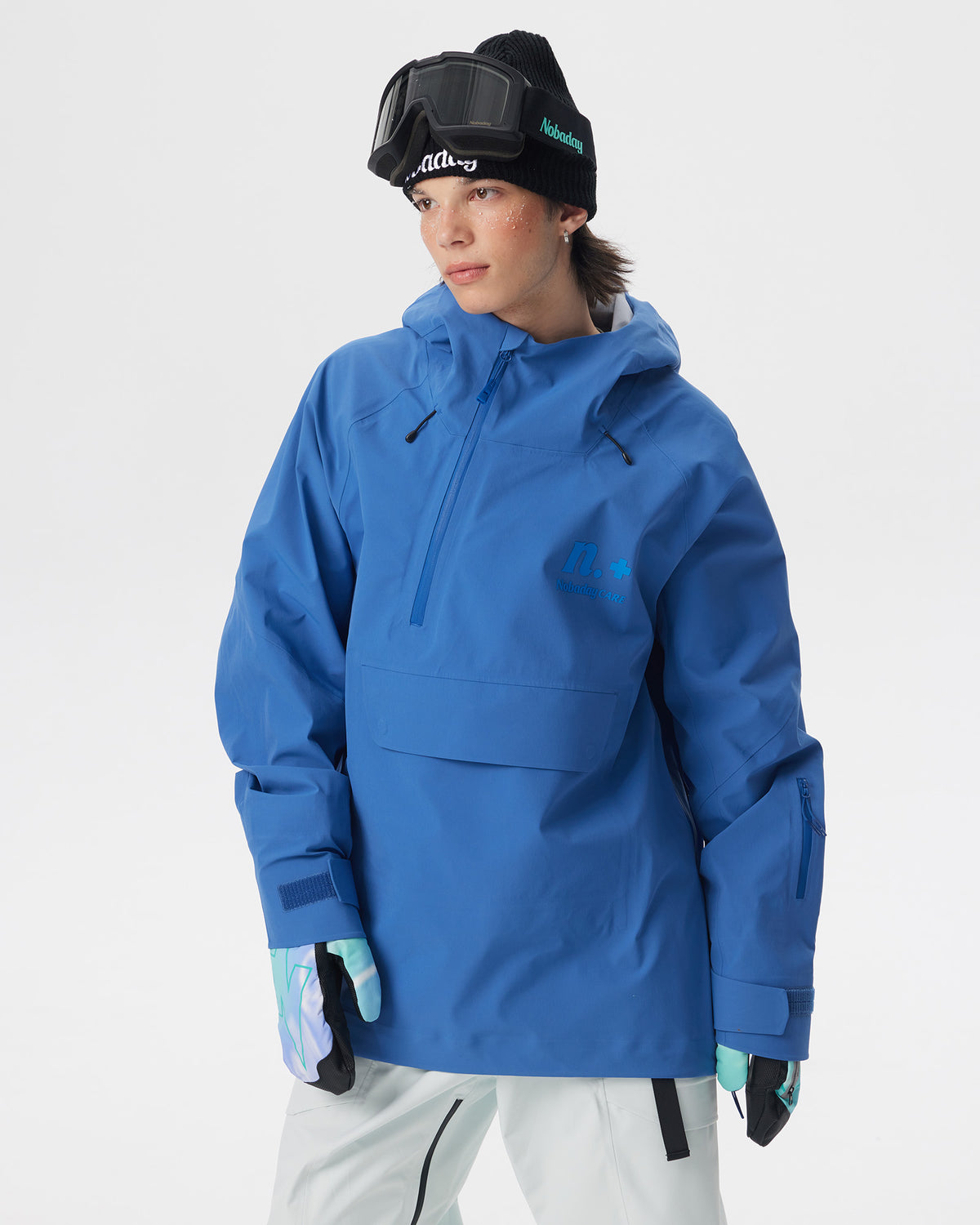 Front view of a male model wearing the blue Nobaday Men’s ArcticStorm 3L Anorak Snow Jacket with a half-zip closure and large flap pocket
