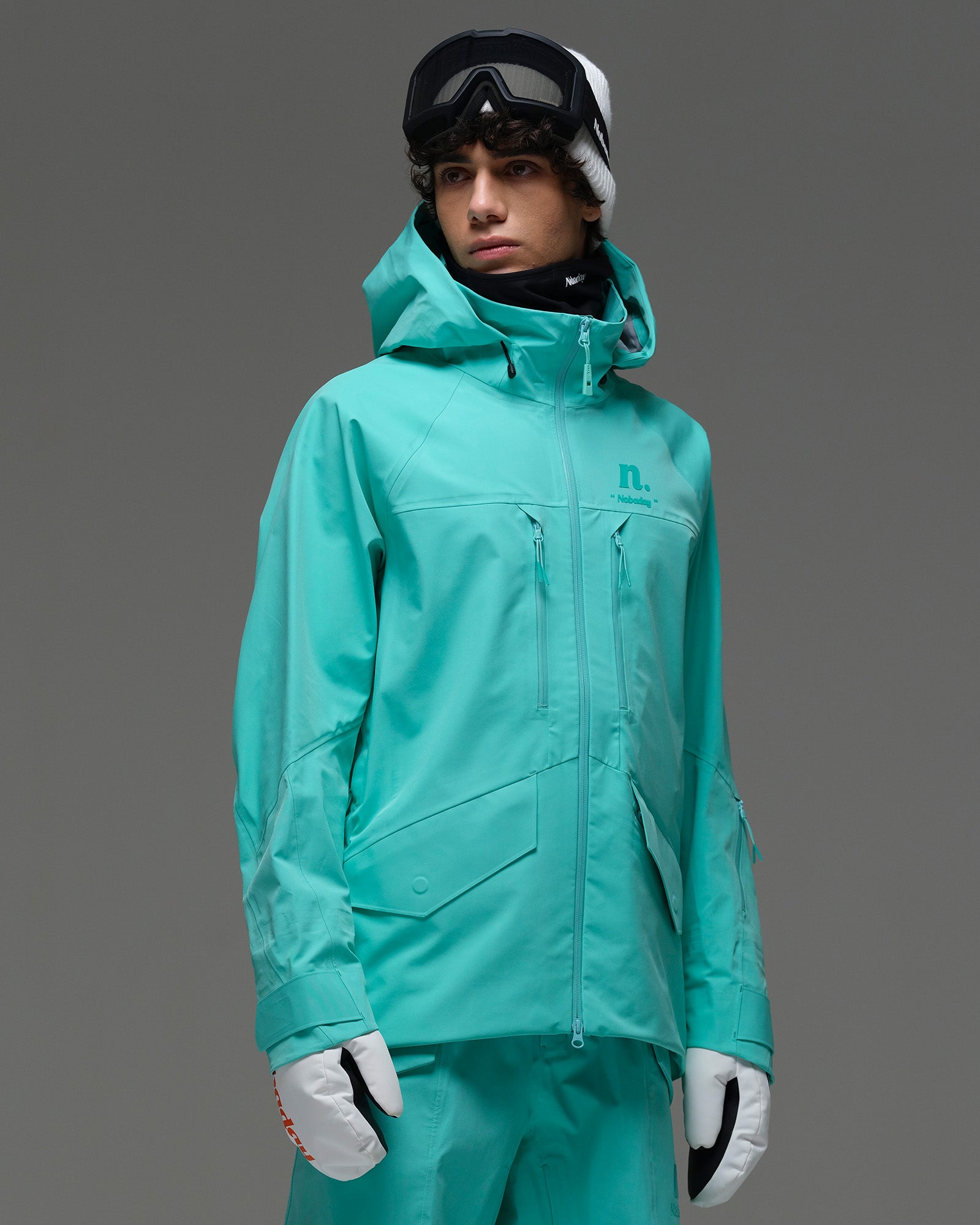 Front view of the NOBADAY Men’s ArcticStorm Freeride 3L blue snow jacket showing the adjustable hood, chest zippers, and large flap pockets