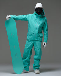 Full-body view of a male snowboarder wearing the NOBADAY Men’s ArcticStorm Freeride 3L blue snow jacket and matching snow pants while holding a snowboard