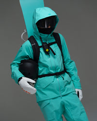Male snowboarder wearing the NOBADAY Men’s ArcticStorm Freeride 3L blue snow jacket with goggles, backpack, helmet, and snowboard gear
