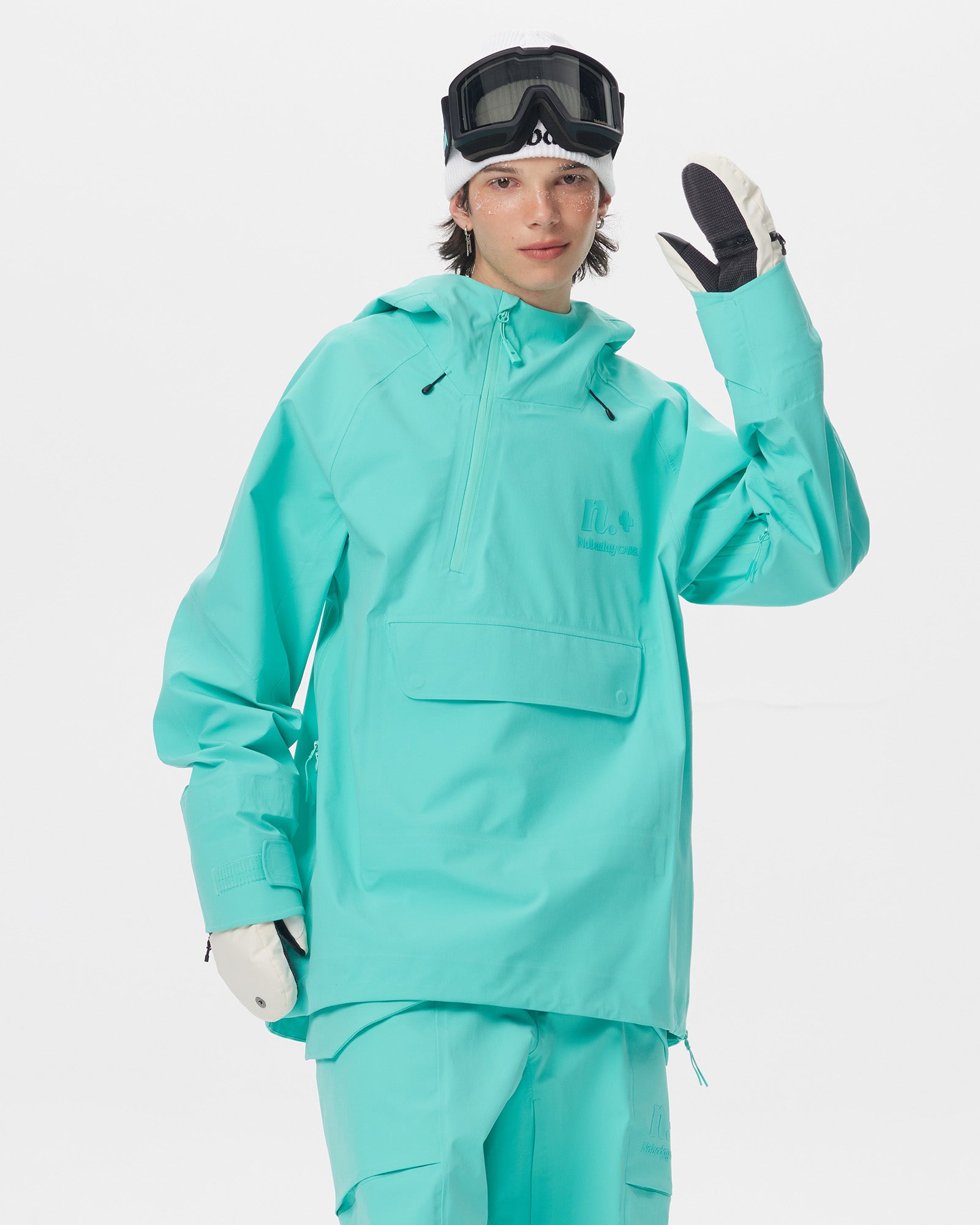 Front view of a male model wearing the Nobaday ArcticStorm Freeride Auroral Blue 3L Anorak Jacket with ski goggles