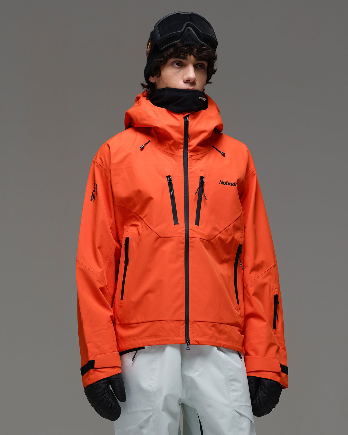 Front view of the NOBADAY Men’s MaxExtreme Pro 3L snow jacket in orange showing the hood and multiple zippered pockets