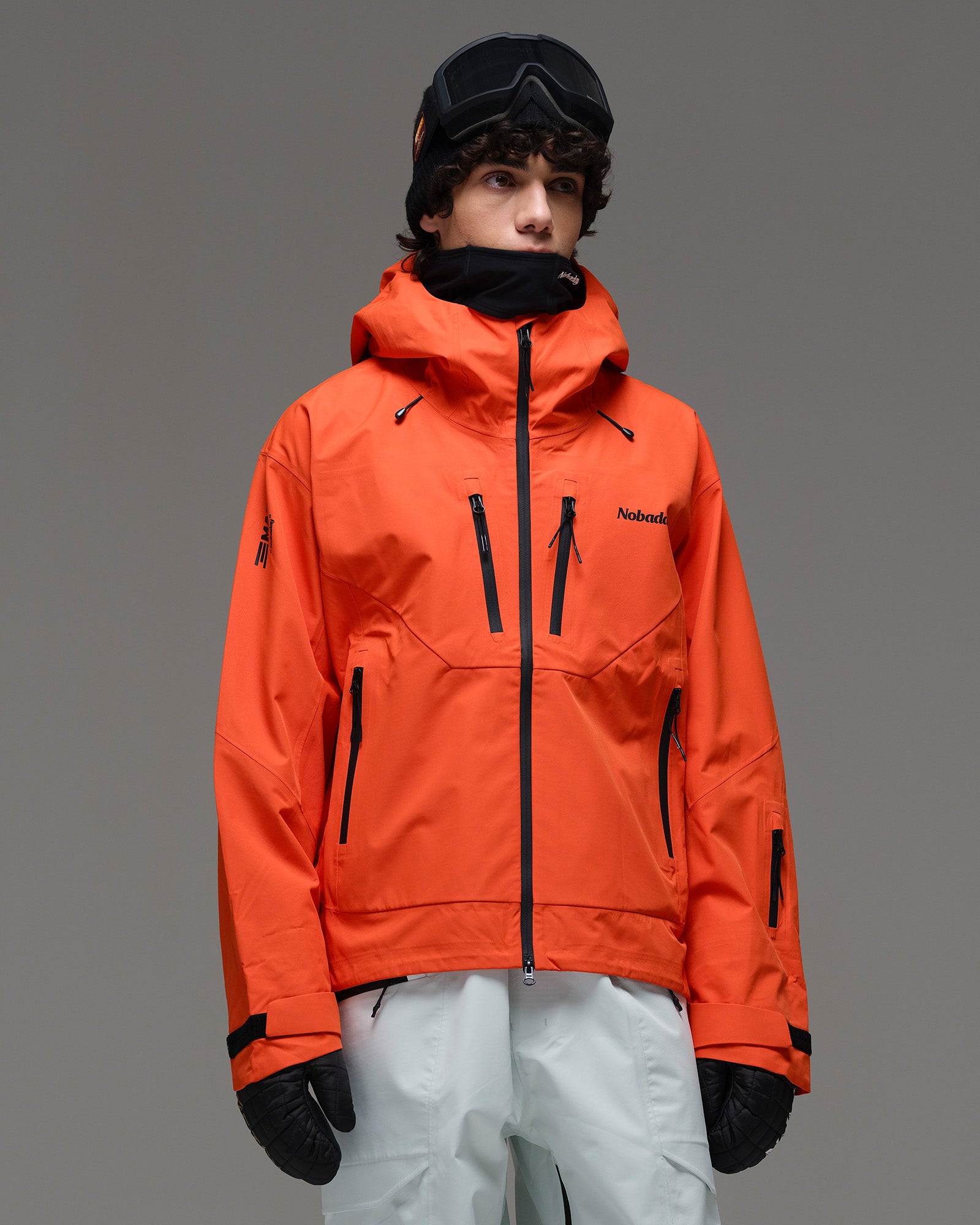 Front view of the NOBADAY Men’s MaxExtreme Pro 3L snow jacket in orange showing the hood and multiple zippered pockets