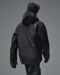 Back view of the black NOBADAY Pure Free Apex 3L snow jacket with a hood and orange logo