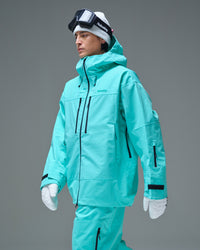 Side view of a man wearing the Nobaday Blue Apex 3L snow jacket with a high collar and sleeve pocket