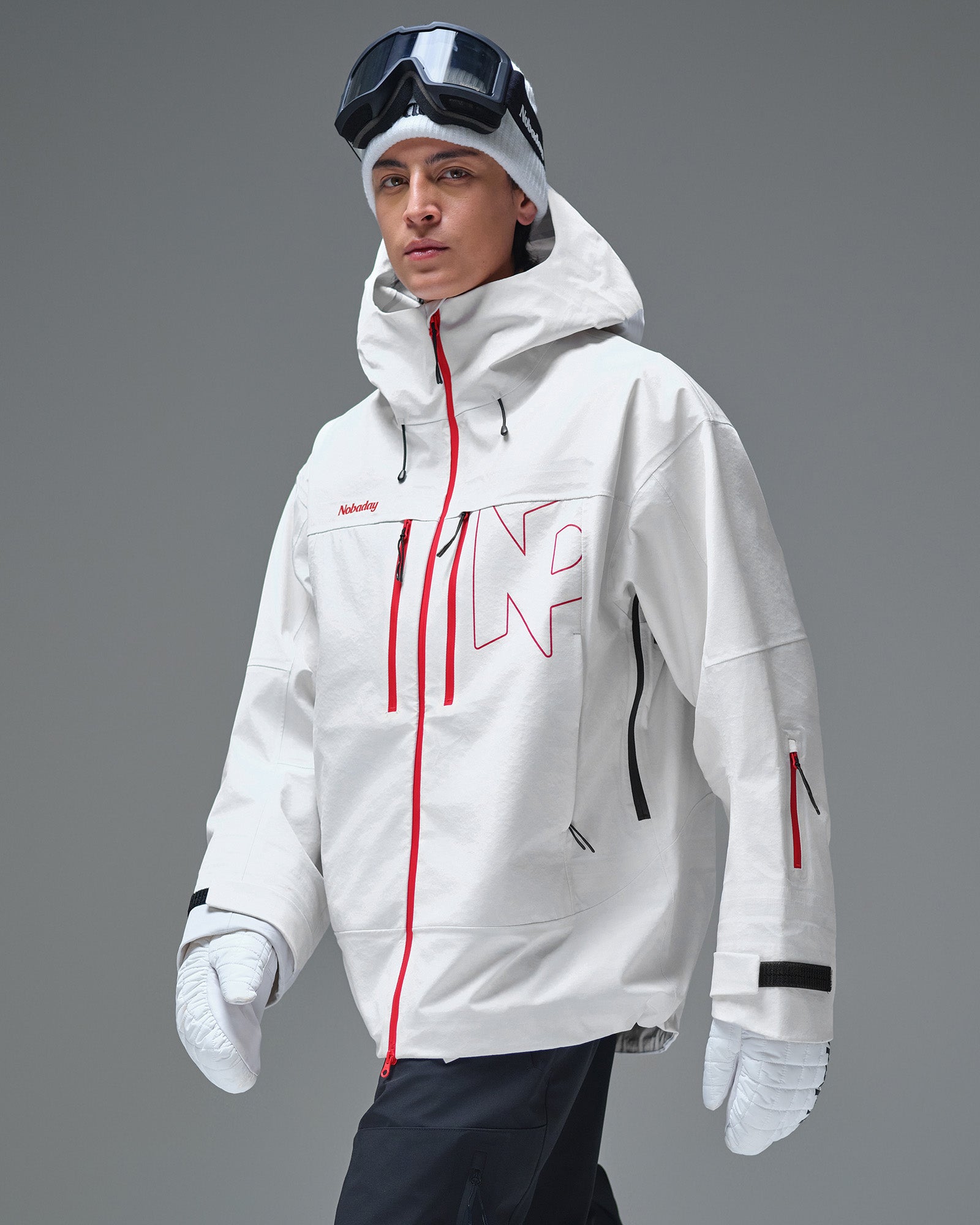 Front three-quarter view of the white NOBADAY Apex 3L snow jacket with red waterproof zippers