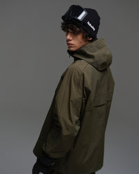 Rear three-quarter view of a man wearing the NOBADAY Pure Free snow jacket in dark green