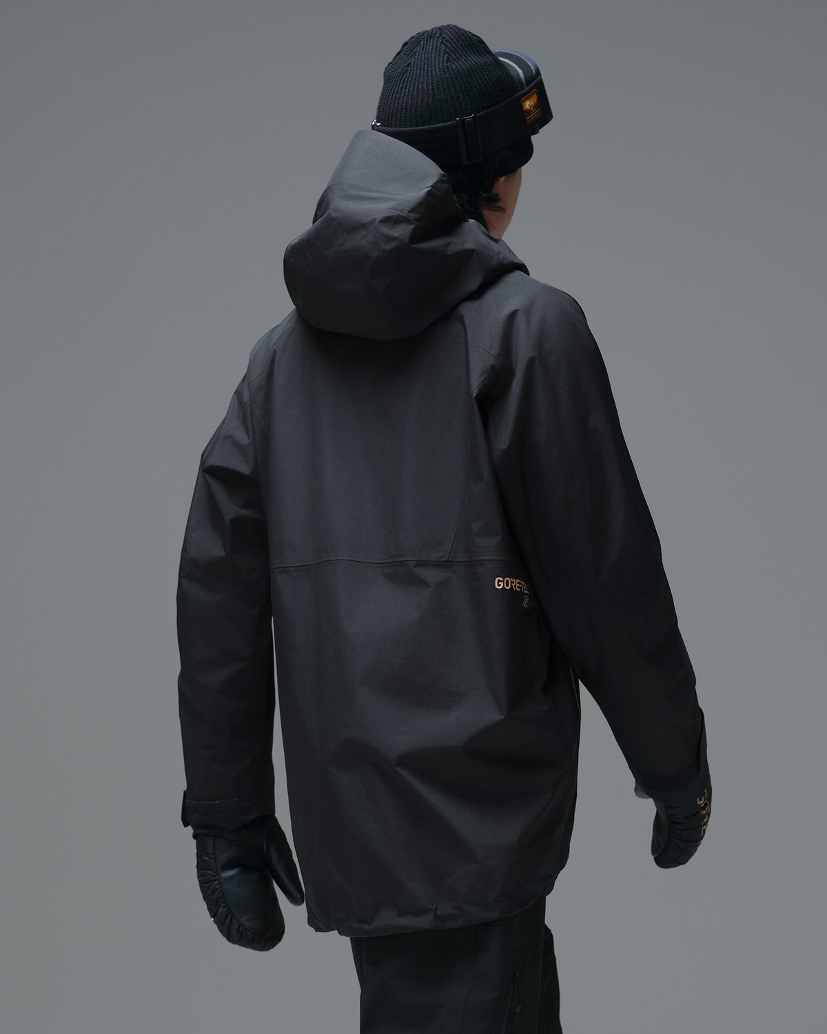 Back view of the Black NOBADAY Men’s Summit GORE-TEX snow jacket showing the hood and rear GORE-TEX logo
