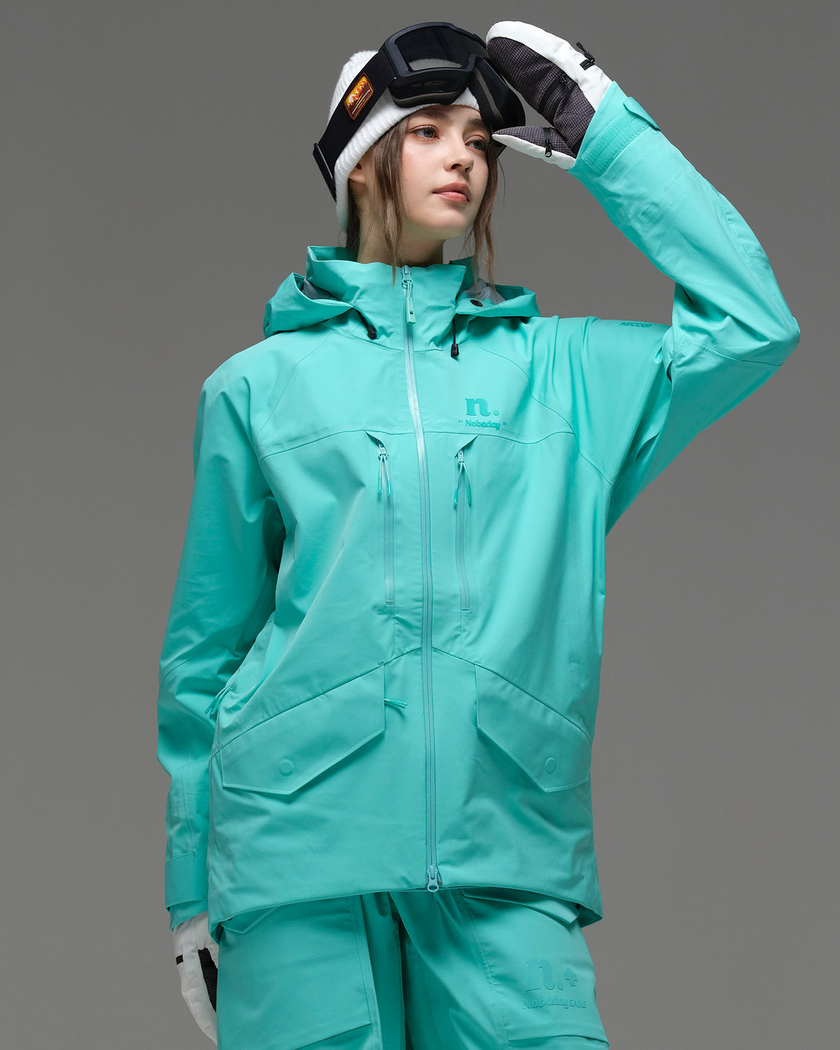 Front view of the NOBADAY Women's ArcticStorm Freeride 3L blue waterproof snow jacket with chest pockets and two-way zipper
