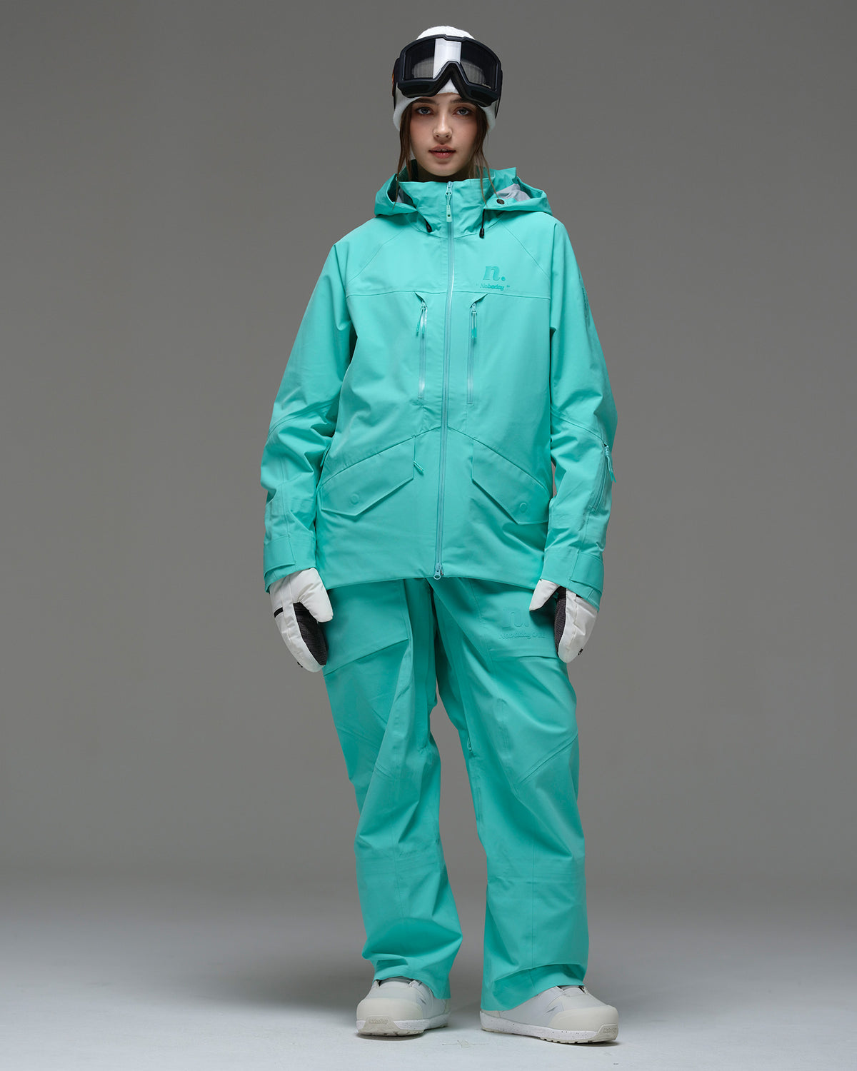 Full-body front view of the NOBADAY Women's ArcticStorm Freeride 3L blue waterproof snow jacket with matching snow pants