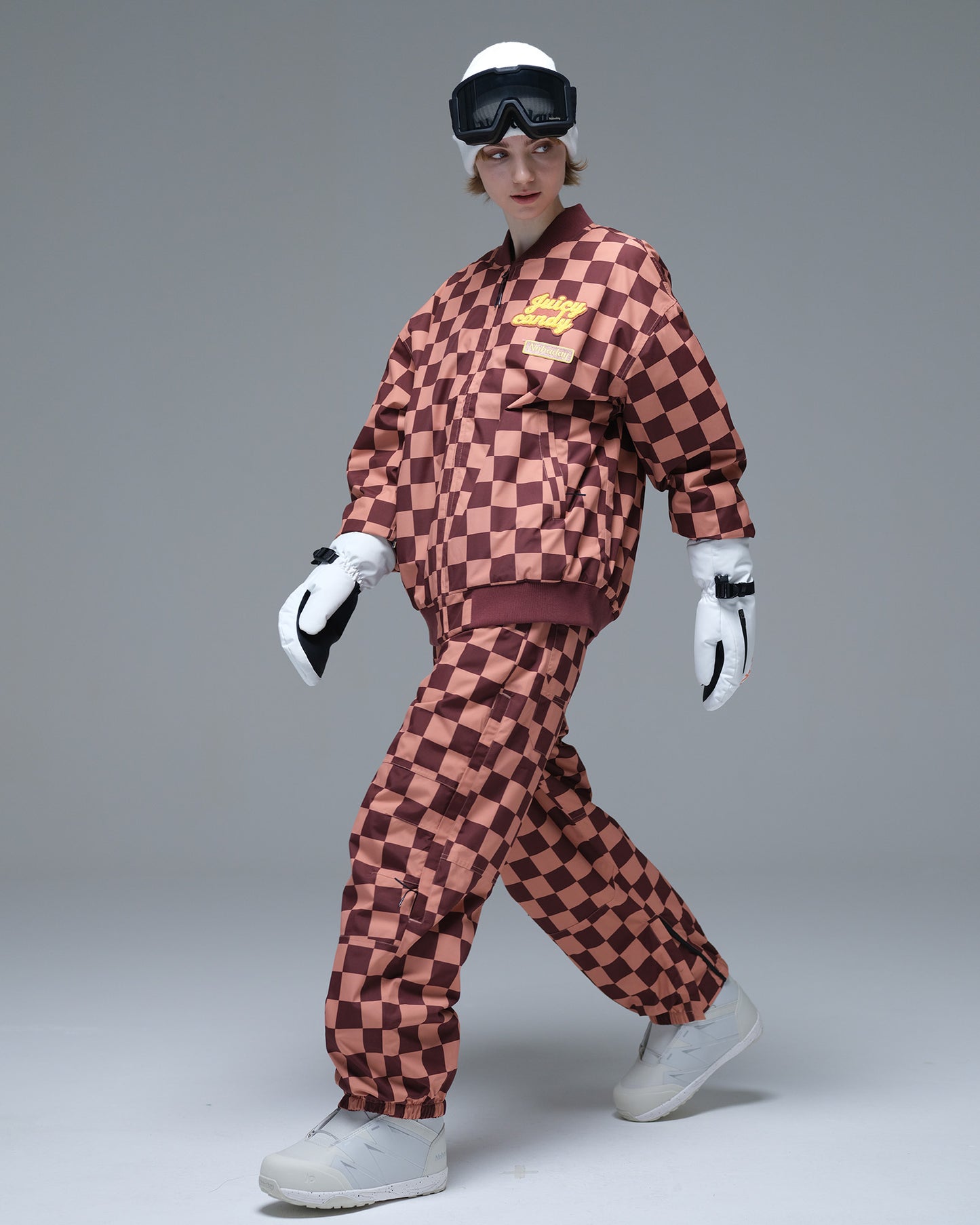 Full-body action view of the brown and pink plaid Nobaday Women’s Baseball Insulated Snow Jacket with an oversized fit