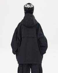 Back view of Nobaday women's black snow jacket showing oversized hood, longline fit, dropped shoulders, and waterproof shell fabric