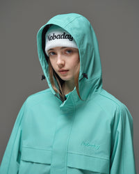 Detail of Nobaday Women's Pure Free Active blue snow jacket with adjustable hood, high collar, storm flap, and embroidered logo