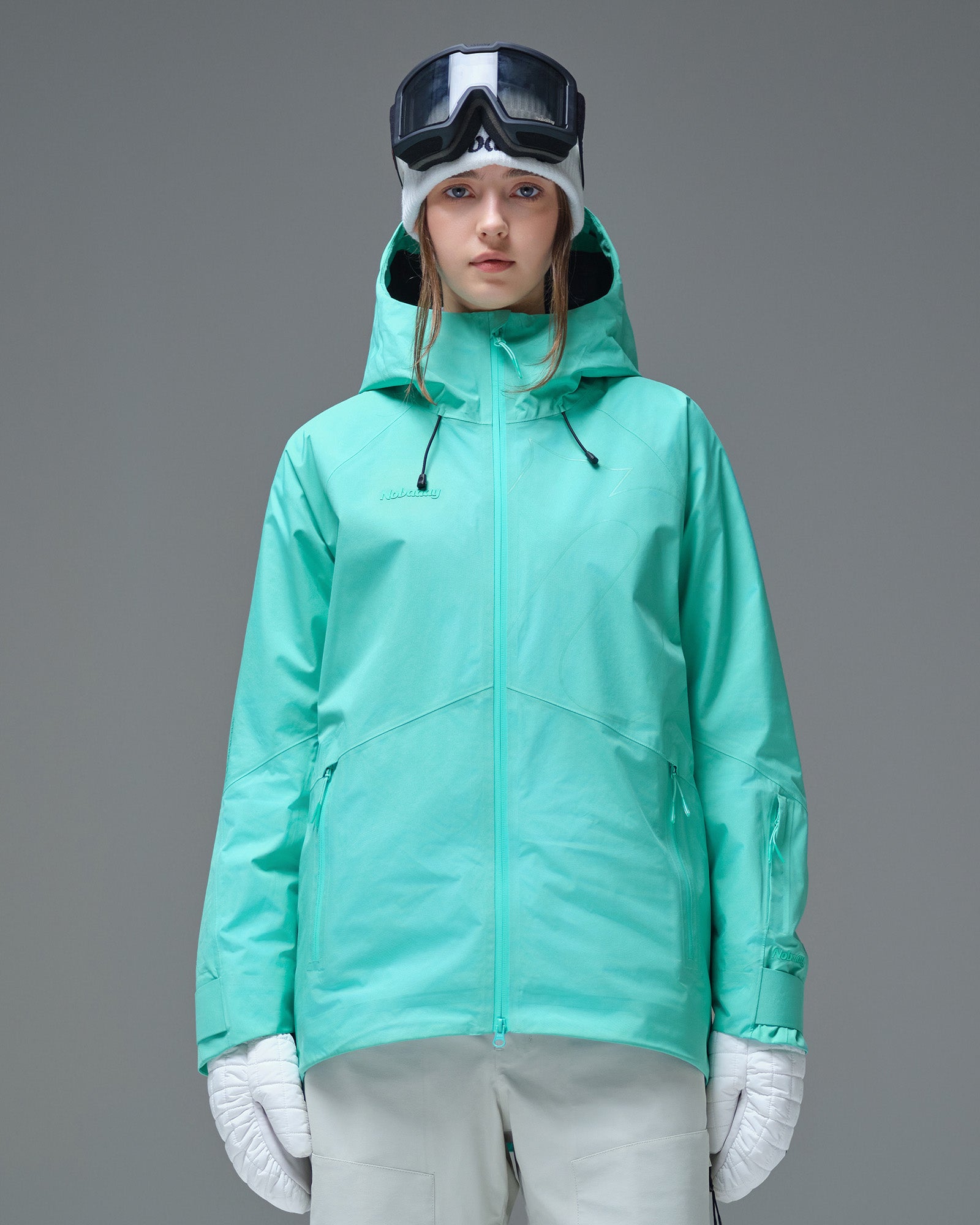 Front view of a woman wearing a Nobaday Blue GORE-TEX snow jacket with an adjustable hood
