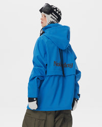 Back view of Nobaday women's blue softshell fleece hoodie showing oversized hood, back logo, relaxed fit, and winter snowboard style