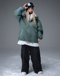 Full body front view of Nobaday women's green active snow jacket with contrast zipper pockets, waterproof shell, and relaxed snowboard fit