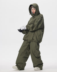 Full body side pose of Nobaday women's green snow jacket with drawcord hem, roomy sleeves, and matching green snow pants