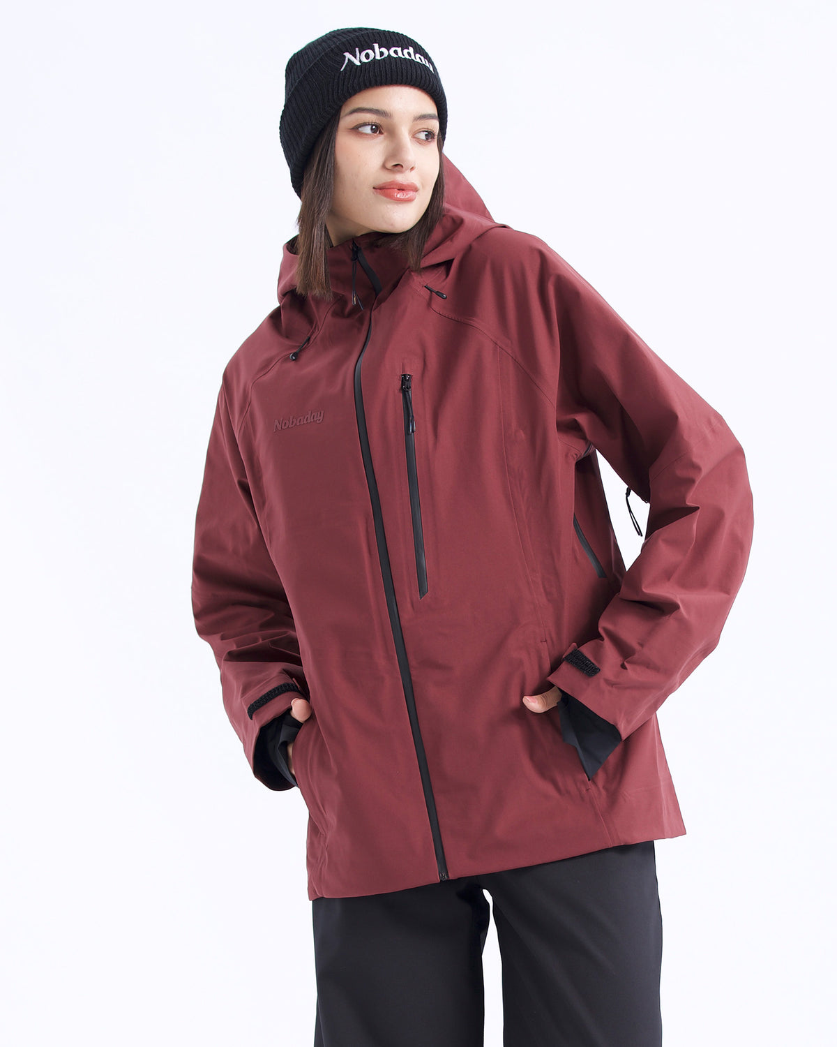 Half-body view of a woman wearing the NOBADAY Women's Juicy 3L dark red waterproof snow jacket with an adjustable hood and zippered pockets