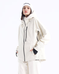 Half-body pose of a woman wearing the NOBADAY Women's Juicy 3L white waterproof snow jacket with a hood and black zippers
