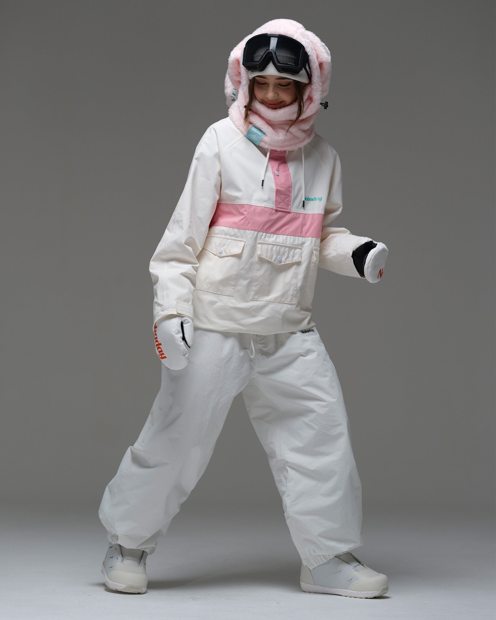 Full-body action view of a model wearing the ivory and pink Nobaday Women’s Juicy Candy Retro Snow Jacket