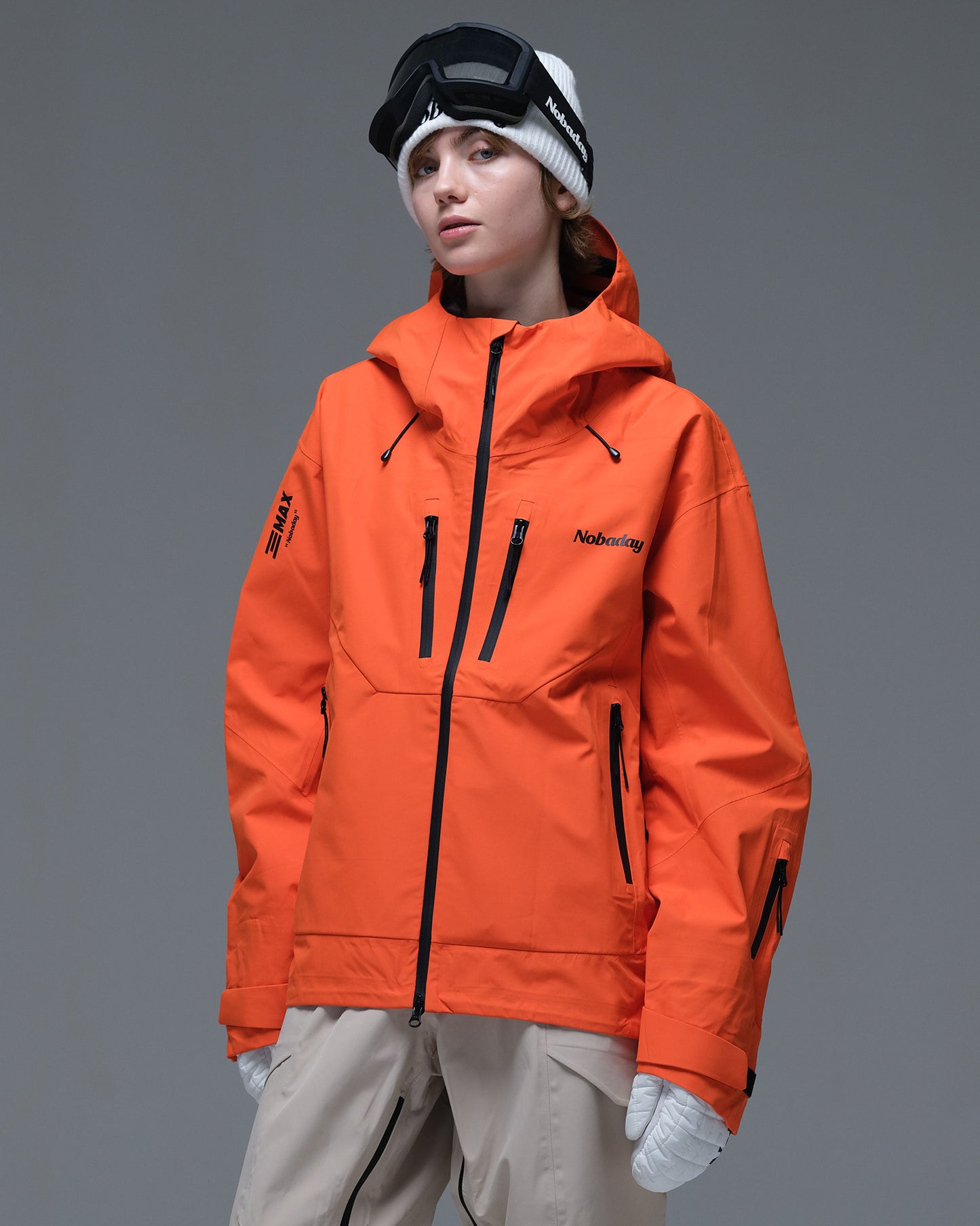 Front view of the orange Nobaday Women’s MaxExtreme Pro Zip-Up 3L Snow Jacket featuring contrasting black zippers and adjustable cuffs