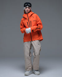 Full-body view of the orange Nobaday Women’s MaxExtreme Pro Zip-Up 3L Snow Jacket featuring multiple zippered pockets and an adjustable hood