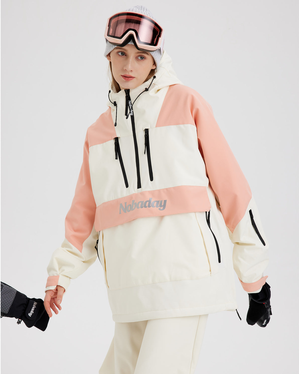 Half-body pose of a woman wearing the NOBADAY Women's pink insulated snow jacket with chest zippers and a large front pocket