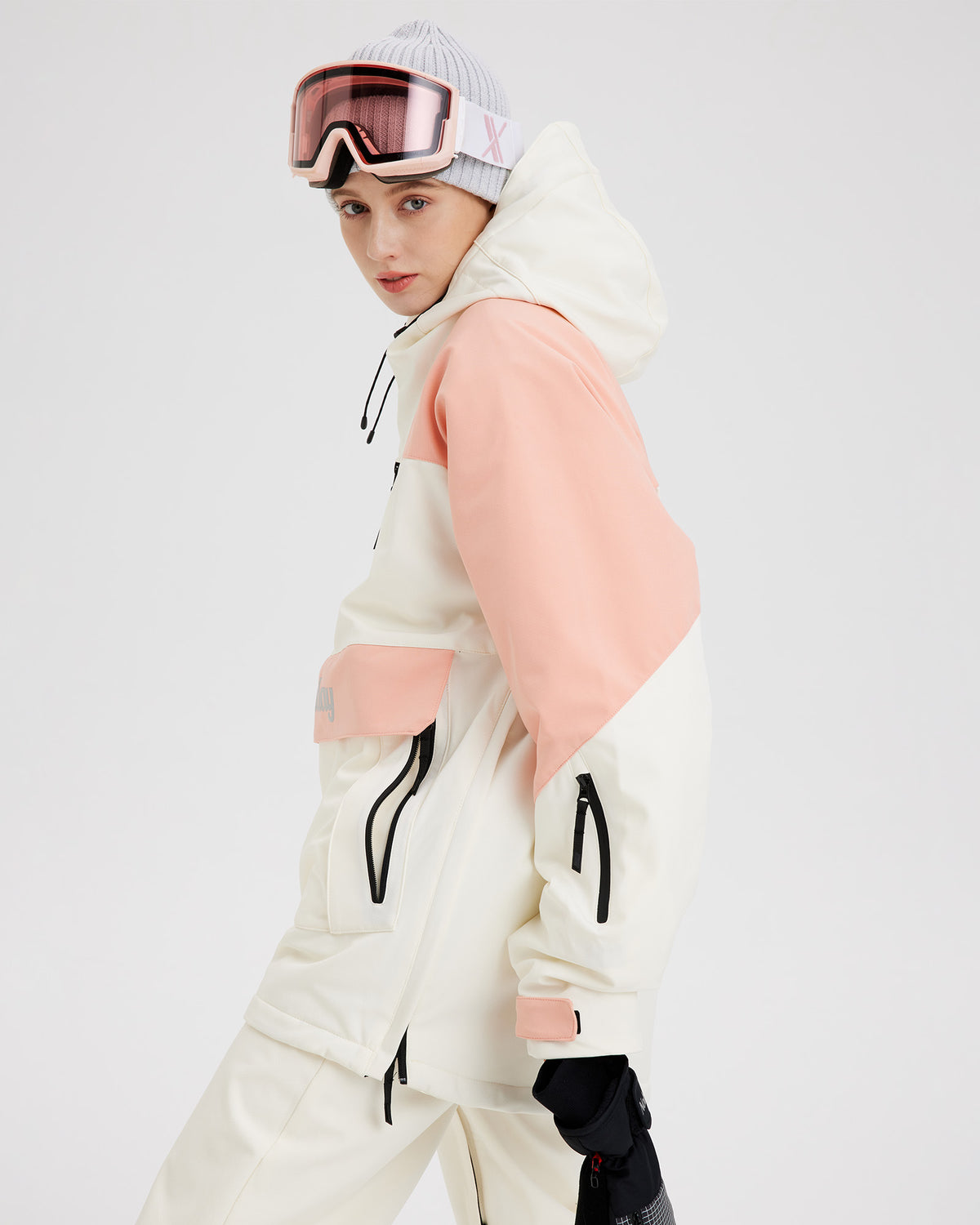 Side view of the NOBADAY Women's pink insulated snow jacket showing the hood, color-block panels, and sleeve pocket