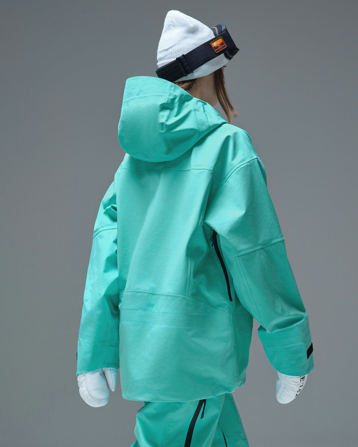 Back view of the Nobaday Women's Pure Free Apex 3L Snow Jacket in blue with an oversized hood
