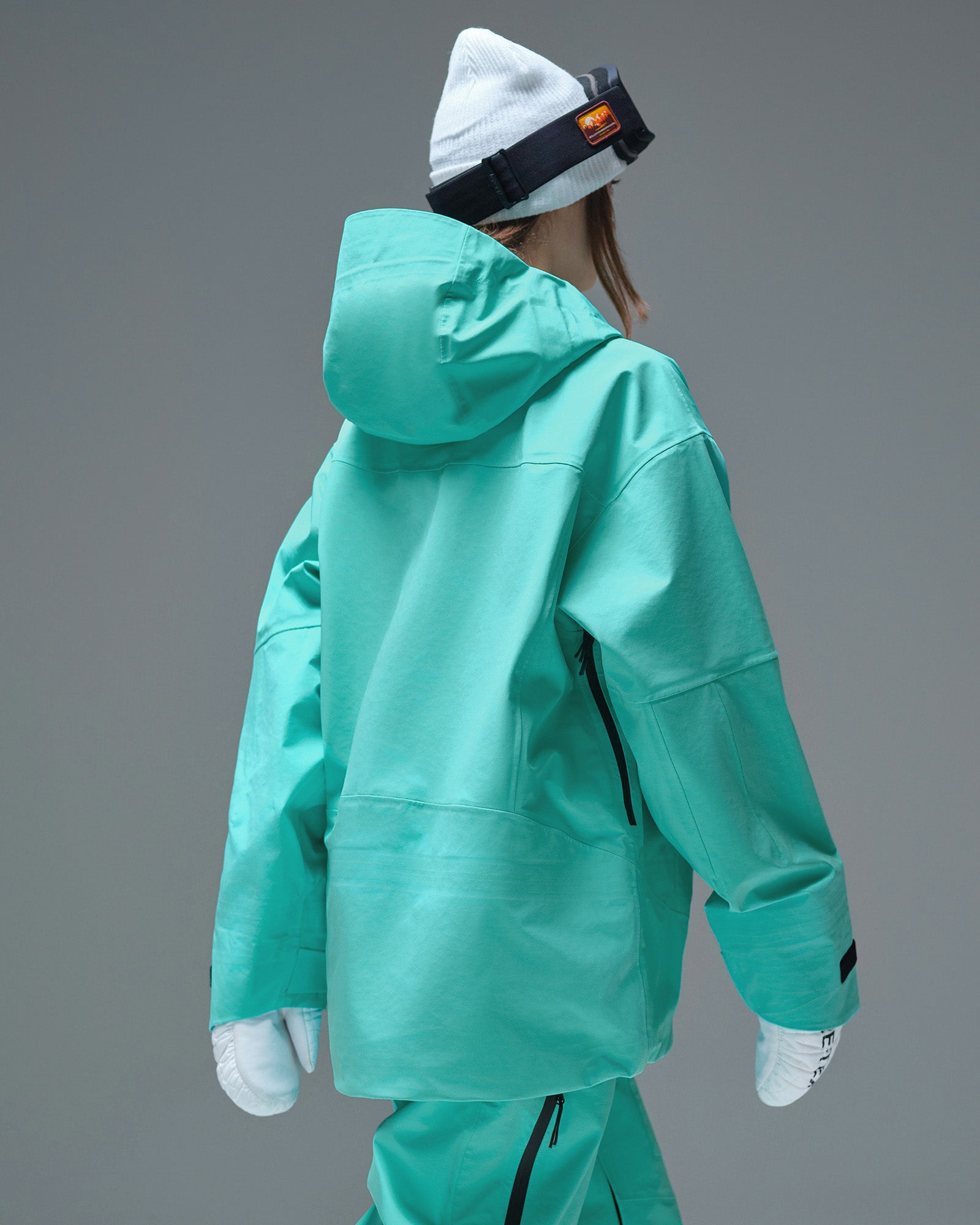 Back view of the Nobaday Women's Pure Free Apex 3L Snow Jacket in blue with an oversized hood