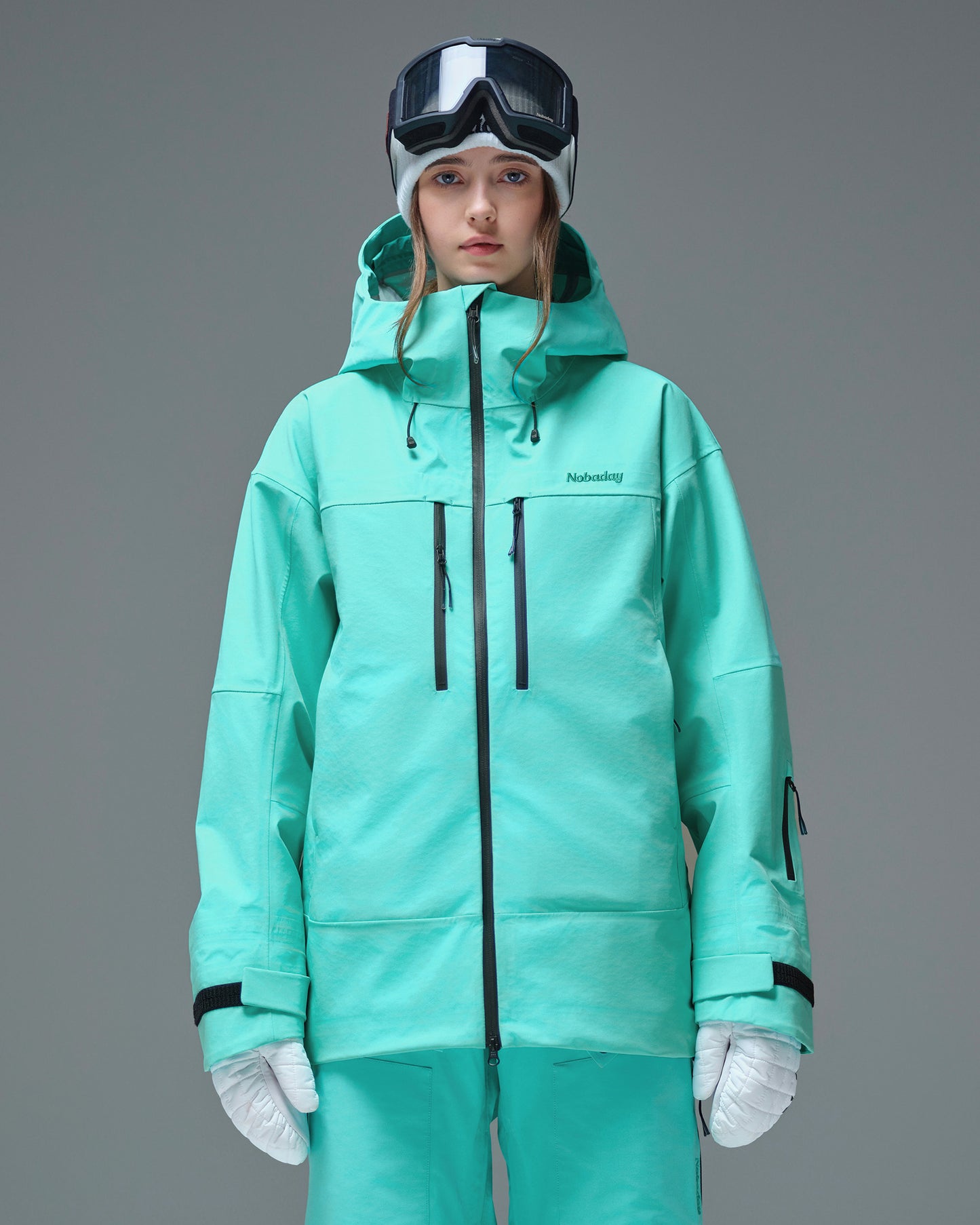 Front view of the Nobaday Women's Pure Free Apex 3L Snow Jacket in blue with waterproof zippers, an adjustable hood and sleeve pass pocket