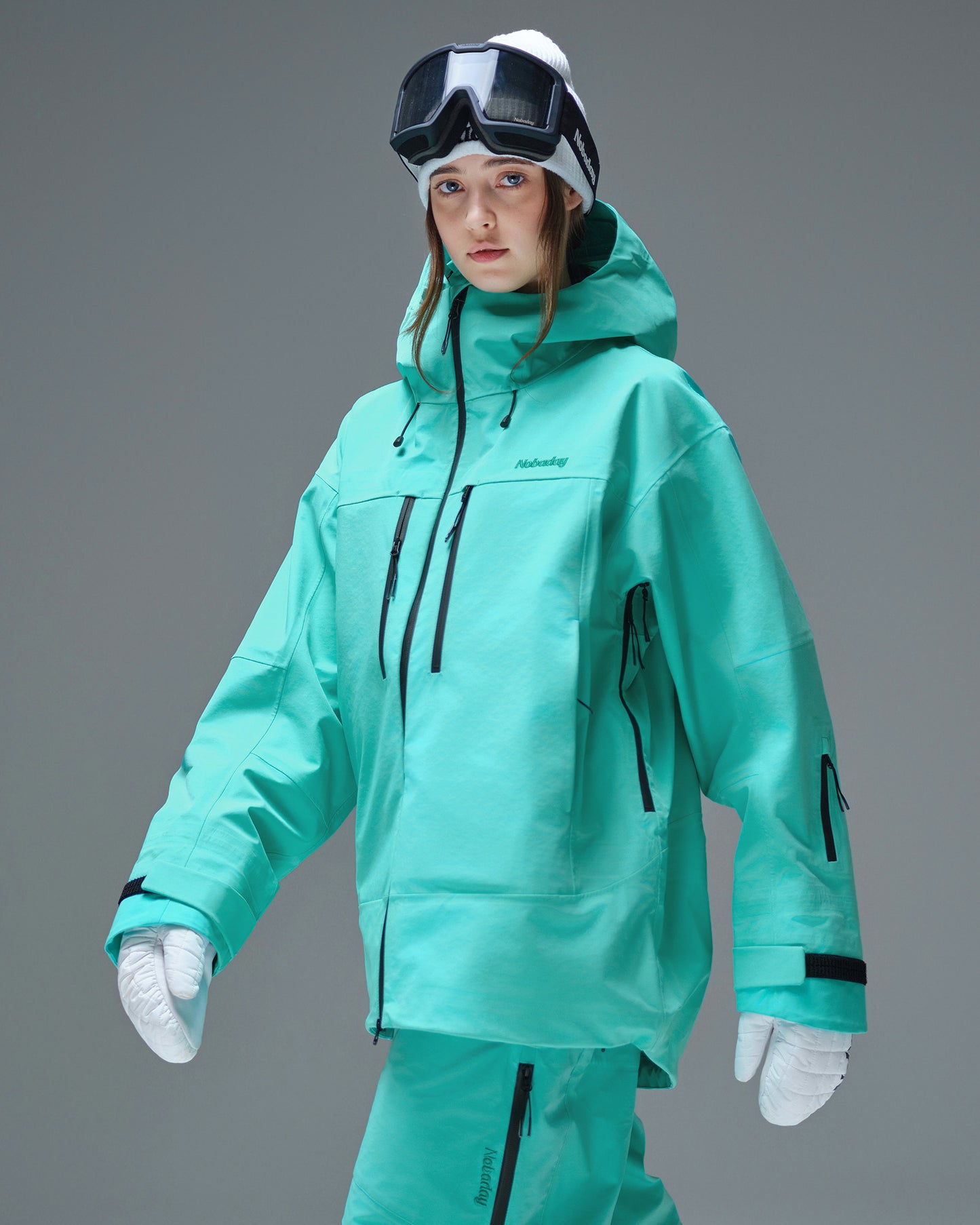 Side view of the Nobaday Women's Pure Free Apex 3L waterproof snow jacket in blue with underarm ventilation zippers