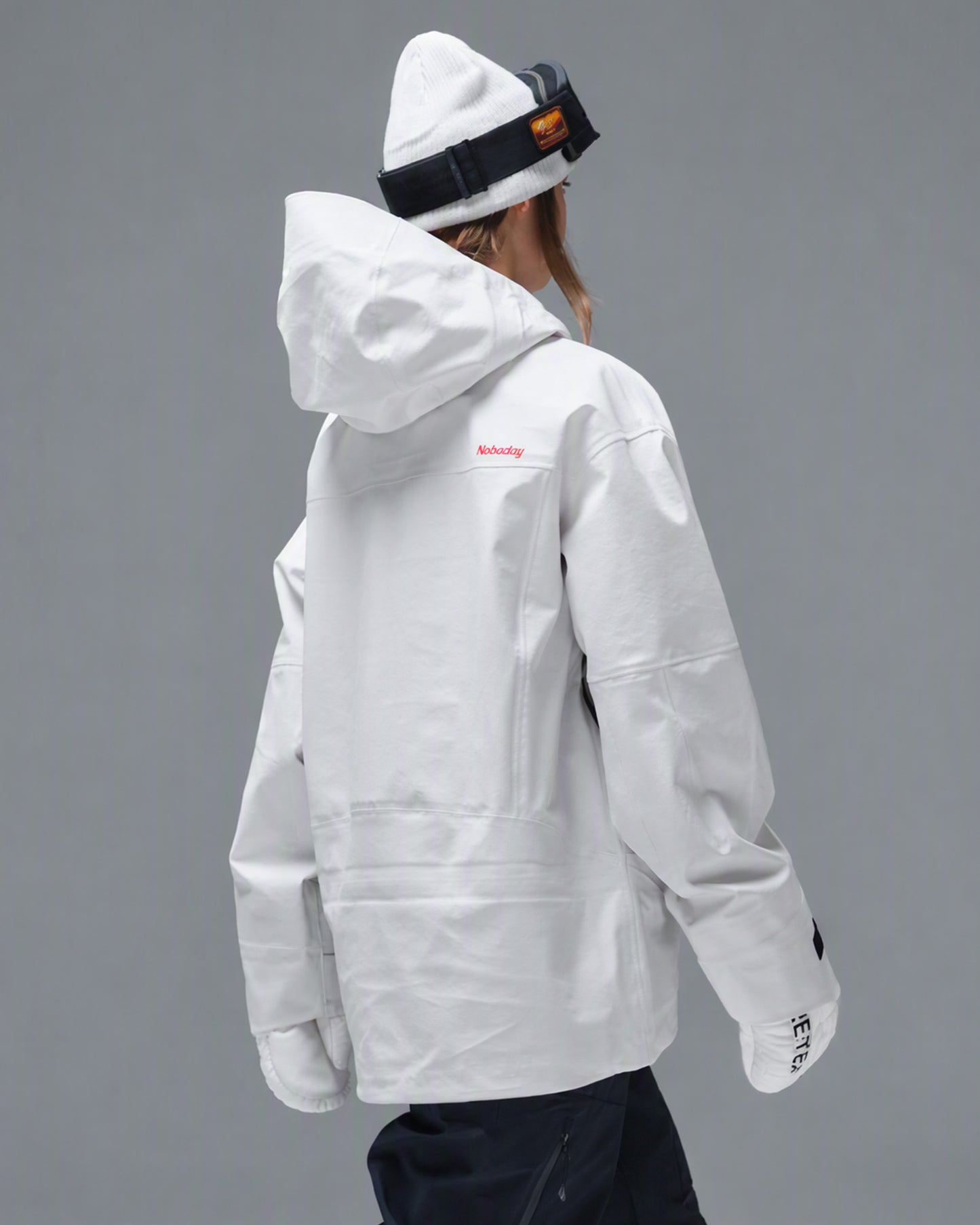 Back view of the Nobaday Women's Pure Free Apex 3L Snow Jacket in white with an oversized hood