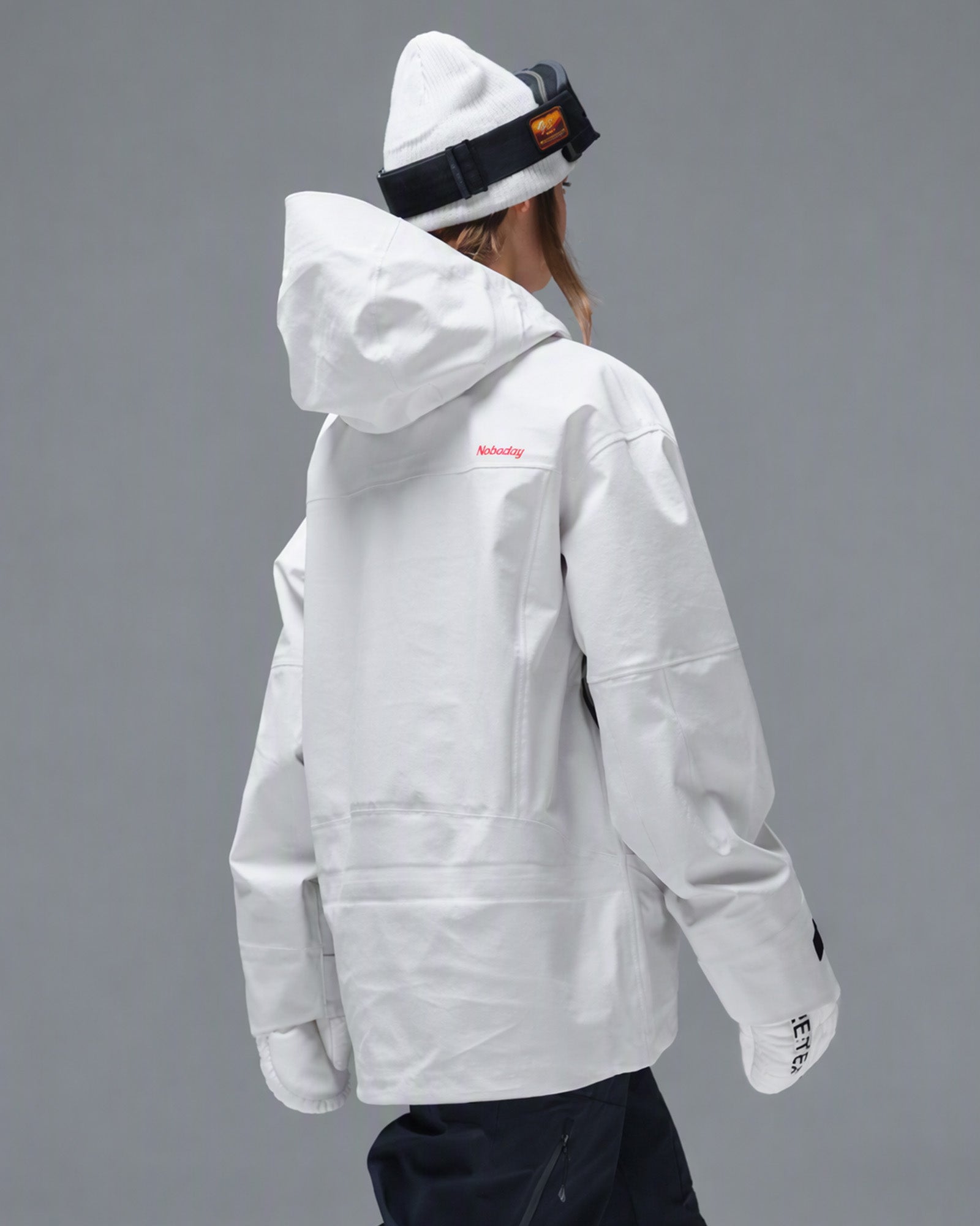 Back view of the Nobaday Women's Pure Free Apex 3L Snow Jacket in white with an oversized hood
