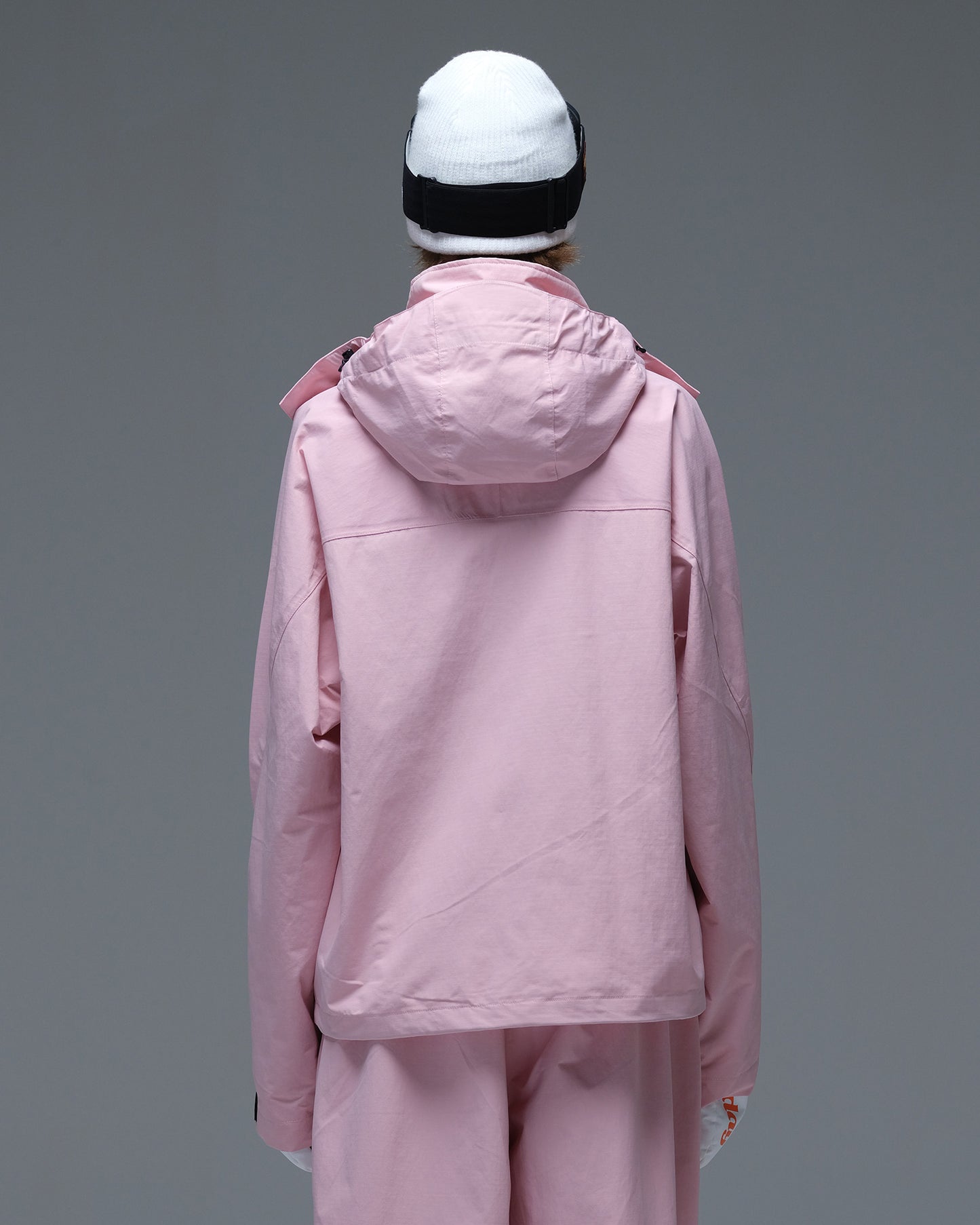 Side view of the pink Nobaday Women’s Pure Free Drift Snow Jacket showing the hood and oversized utility-pocket design