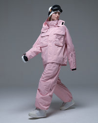 Full-body action view of a model wearing the pink Nobaday Women’s Pure Free Drift Snow Jacket with matching snow pants