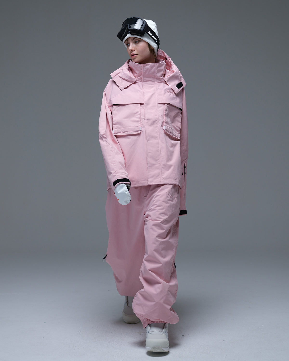Full-body view of the pink Nobaday Women’s Pure Free Drift Snow Jacket styled with matching pink snow pants