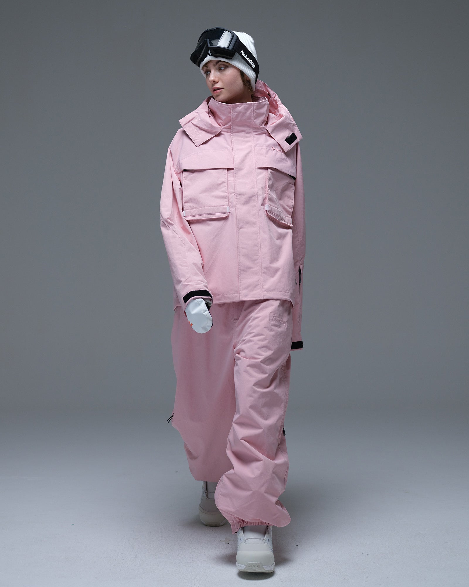 Full-body view of the pink Nobaday Women’s Pure Free Drift Snow Jacket styled with matching pink snow pants