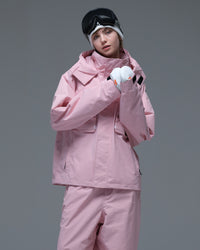 Half-body view of a model wearing the pink Nobaday Women’s Pure Free Drift Snow Jacket with front utility pockets