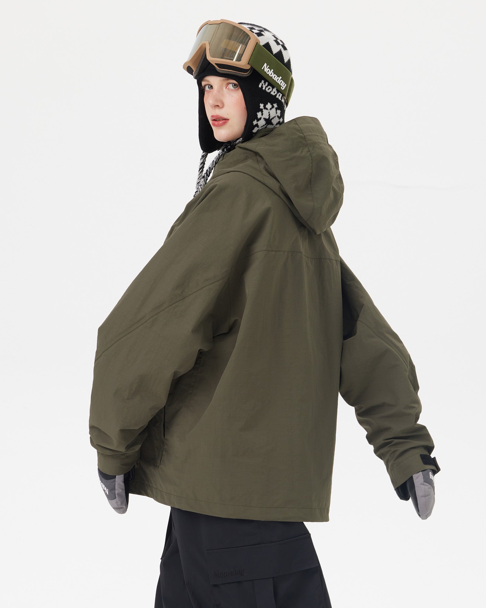 Back view of the NOBADAY Women's Pure Free Freestyle dark green snow jacket showing the protective hood and oversized silhouette